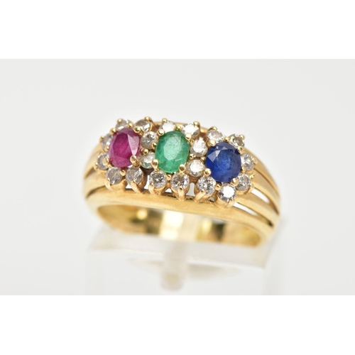 63 - AN 18CT GOLD MUTLI GEM SET RING, designed with an oval cut ruby, emerald and blue sapphire, each wit... 