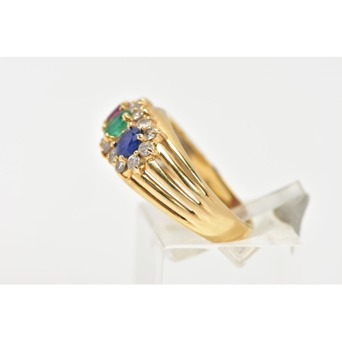 63 - AN 18CT GOLD MUTLI GEM SET RING, designed with an oval cut ruby, emerald and blue sapphire, each wit... 