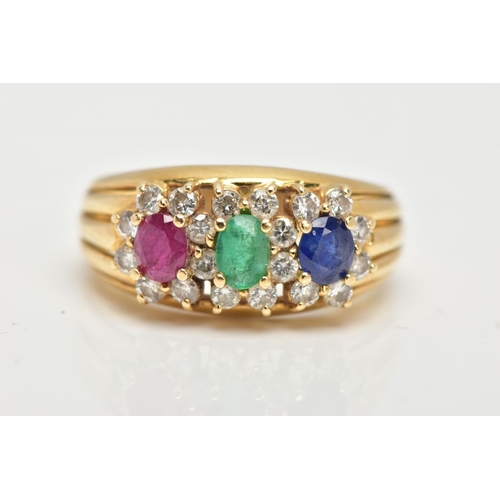 63 - AN 18CT GOLD MUTLI GEM SET RING, designed with an oval cut ruby, emerald and blue sapphire, each wit... 