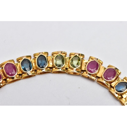 64 - A YELLOW METAL MULTI GEM SET LINE BRACELET, designed with square links each set with alternating ova... 