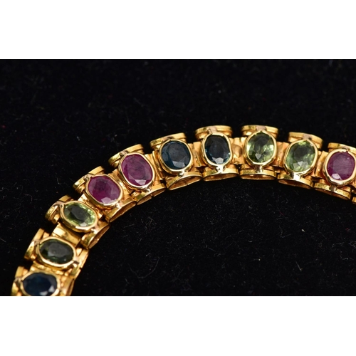 64 - A YELLOW METAL MULTI GEM SET LINE BRACELET, designed with square links each set with alternating ova... 