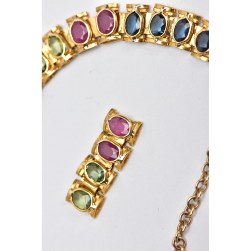 64 - A YELLOW METAL MULTI GEM SET LINE BRACELET, designed with square links each set with alternating ova... 