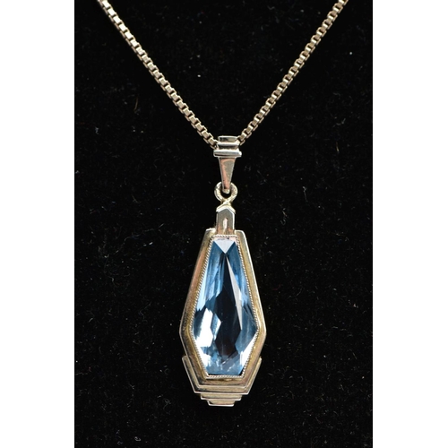 65 - A PENDANT NECKLACE, the pendant of an art deco style set with a light blue fancy cut stone assessed ... 