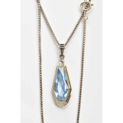 65 - A PENDANT NECKLACE, the pendant of an art deco style set with a light blue fancy cut stone assessed ... 