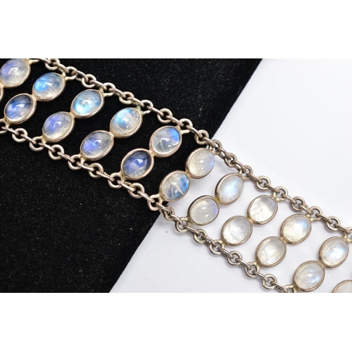 66 - A WHITE METAL MOONSTONE BRACELET, designed with two rows of oval cabochon moonstones each collet mou... 