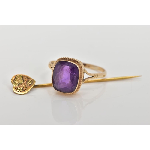 73 - A 9CT GOLD AMETHYST RING AND A STICK PIN, the ring designed with a cushion cut amethyst, collet moun... 