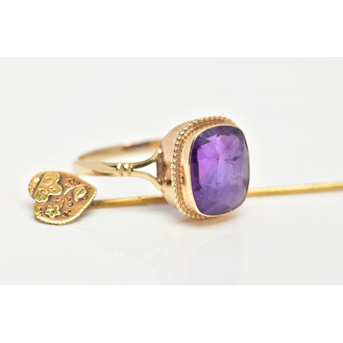 73 - A 9CT GOLD AMETHYST RING AND A STICK PIN, the ring designed with a cushion cut amethyst, collet moun... 