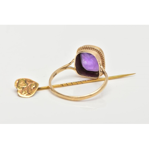 73 - A 9CT GOLD AMETHYST RING AND A STICK PIN, the ring designed with a cushion cut amethyst, collet moun... 