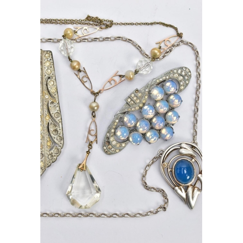 89 - AN 'OLA M GORIE' PENDANT AND CHAIN, a white metal open work heart pendant set with a blue oval caboc... 