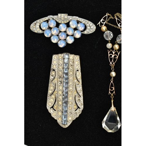 89 - AN 'OLA M GORIE' PENDANT AND CHAIN, a white metal open work heart pendant set with a blue oval caboc... 