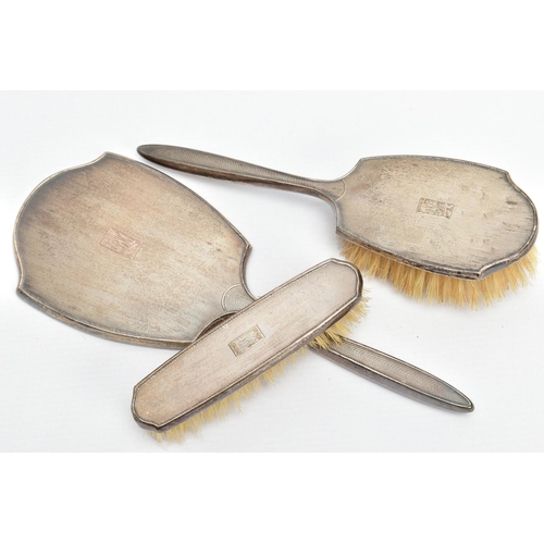 97 - THREE SILVER VANITY PIECES, comprising of a mirror, hair brush and clothes brush, each with an engin... 