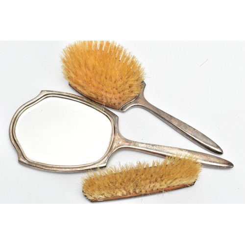 97 - THREE SILVER VANITY PIECES, comprising of a mirror, hair brush and clothes brush, each with an engin... 