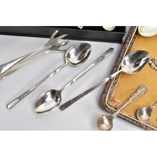 98 - AN ASSORTMENT OF SILVER SPOONS AND SUGAR TONGS, to include a set of six teaspoons with apostles to e... 