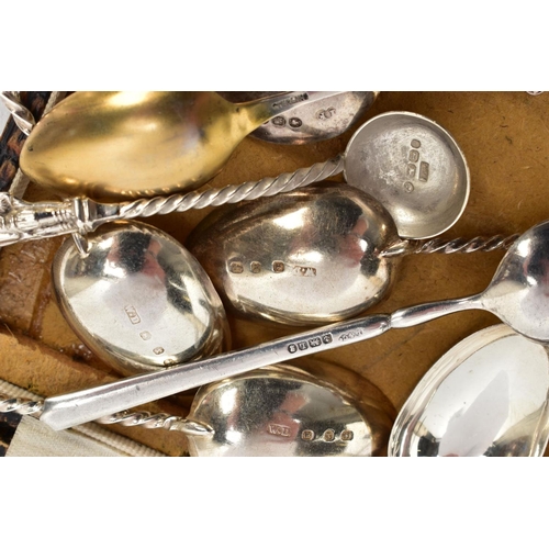 98 - AN ASSORTMENT OF SILVER SPOONS AND SUGAR TONGS, to include a set of six teaspoons with apostles to e... 