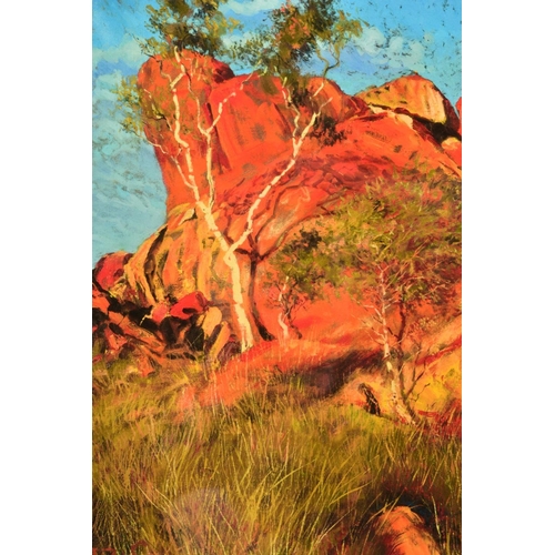 427 - ROLF HARRIS (AUSTRALIAN 1930) 'SUN ON DEVIL'S MARBLES', a limited edition print of an Australian lan... 