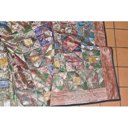 696 - A PATCHWORK BEDSPREAD, Thai silk style decoration, approximate size 266cm x 214cm, good overall cond... 