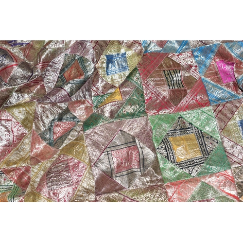 696 - A PATCHWORK BEDSPREAD, Thai silk style decoration, approximate size 266cm x 214cm, good overall cond... 