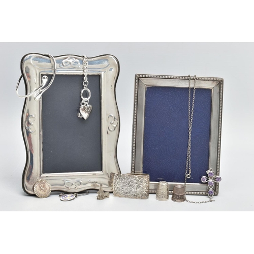 99 - TWO SILVER PHOTO FRAMES AND AN ASSORTMENT OF SILVER AND WHITE METAL JEWELLERY, the first frame featu... 