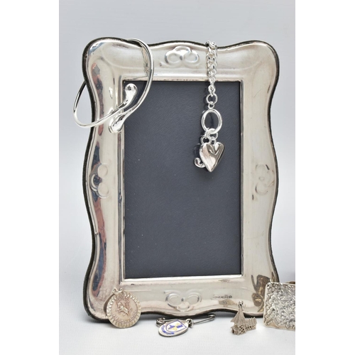 99 - TWO SILVER PHOTO FRAMES AND AN ASSORTMENT OF SILVER AND WHITE METAL JEWELLERY, the first frame featu... 