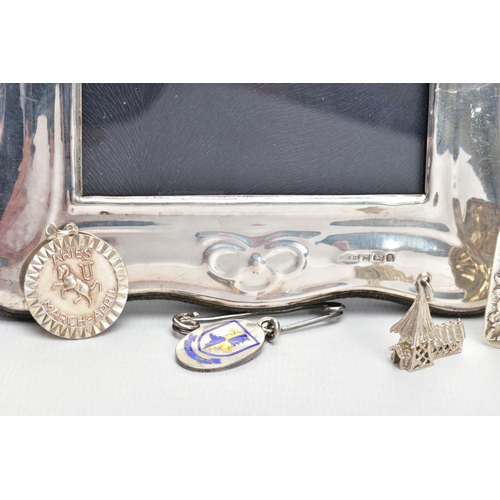 99 - TWO SILVER PHOTO FRAMES AND AN ASSORTMENT OF SILVER AND WHITE METAL JEWELLERY, the first frame featu... 