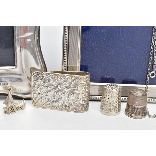 99 - TWO SILVER PHOTO FRAMES AND AN ASSORTMENT OF SILVER AND WHITE METAL JEWELLERY, the first frame featu... 