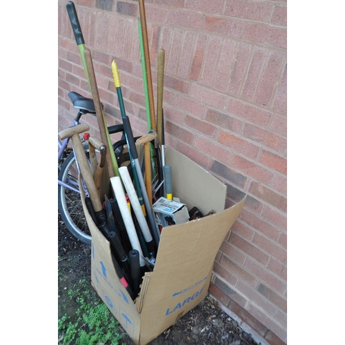 1206 - A BOX CONTAINING A QUANTITY OF GARDEN TOOLS including spades , rakes, clippers etc