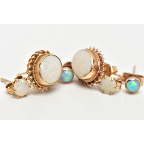 12 - THREE PAIRS OF OPAL EARRINGS, to include a pair of oval opal earrings bezel set within a rope twist ... 