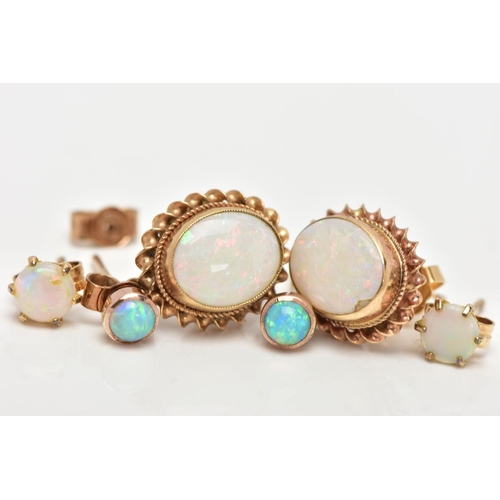 12 - THREE PAIRS OF OPAL EARRINGS, to include a pair of oval opal earrings bezel set within a rope twist ... 