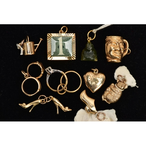 13 - NINE 9CT GOLD CHARMS AND A NEPHRITE JADE CHARM, nine charms in forms such as a watering can, a koala... 