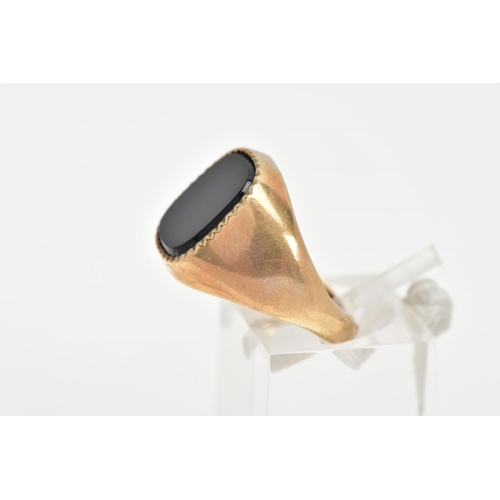 15 - A 9CT GOLD ONYX SIGNET RING, a rounded square cut onyx set with a milgrain edge, approximate width 1... 