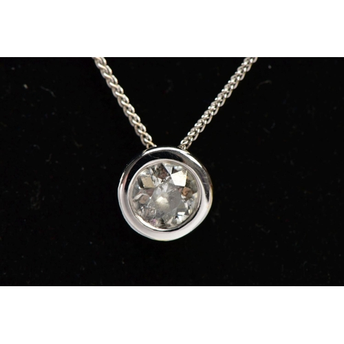 25 - AN 18CT GOLD DIAMOND PENDANT NECKLACE, a single round brilliant cut diamond bezel set in white gold,... 