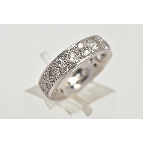 26 - AN 18CT GOLD DIAMOND ETERNITY RING, fourteen vary cut and size diamonds in a grain set 18ct white go... 