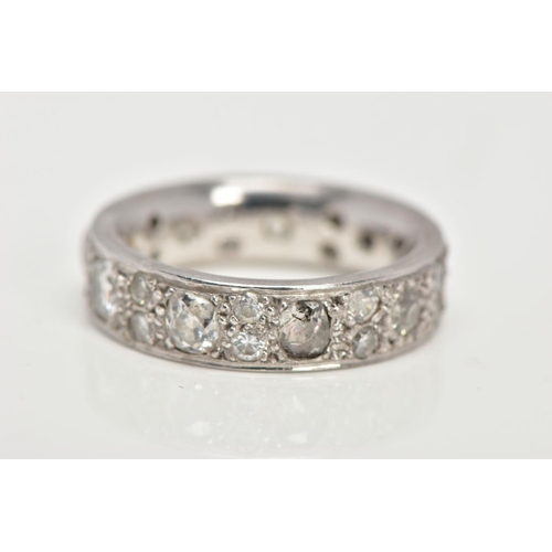 26 - AN 18CT GOLD DIAMOND ETERNITY RING, fourteen vary cut and size diamonds in a grain set 18ct white go... 