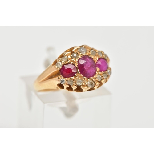 3 - AN EARLY 20TH CENTURY DIAMOND AND RUBY RING, designed with three oval cut rubies, within a surround ... 