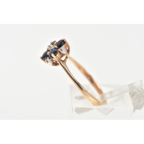 31 - A 9CT GOLD SAPPHIRE AND DIAMOND RING, four circular cut blue sapphires set with five round brilliant... 