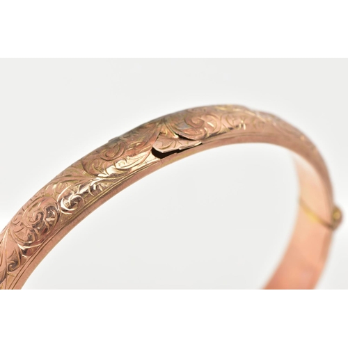 44 - A 9CT GOLD BANGLE, an AF hinged hollow domed bangle with scrolling foliage detail, approximate width... 