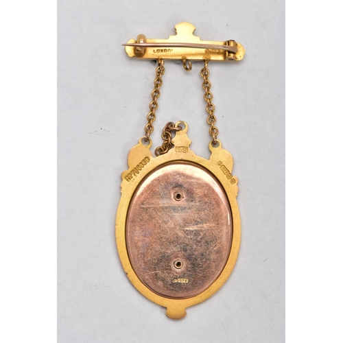 47 - A 9CT GOLD AND ENAMEL MASONIC FOB BROOCH, a gold oval frame depicting a kneeling man and a robed wom... 