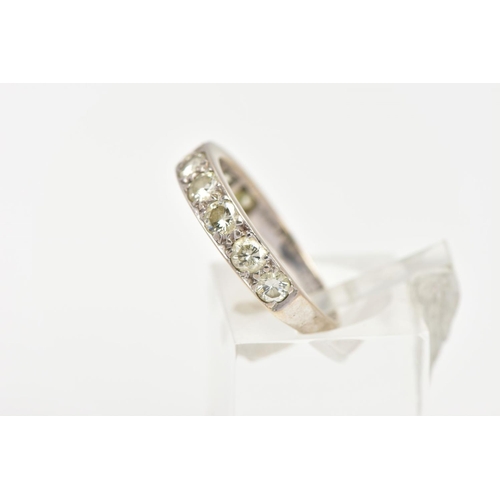 6 - A NINE STONE DIAMOND RING, nine round brilliant cut diamonds grain set in a white metal mount, appro... 