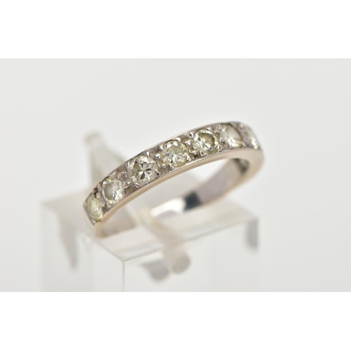 6 - A NINE STONE DIAMOND RING, nine round brilliant cut diamonds grain set in a white metal mount, appro... 