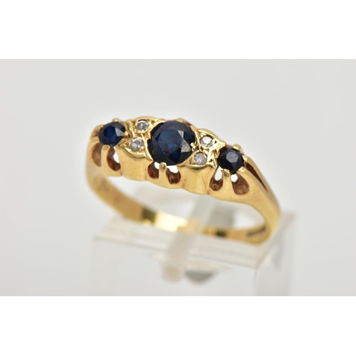 68 - AN 18CT GOLD SAPPHIRE AND DIAMOND RING, designed with three graduated blue sapphires, interspaced wi... 