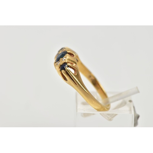 68 - AN 18CT GOLD SAPPHIRE AND DIAMOND RING, designed with three graduated blue sapphires, interspaced wi... 