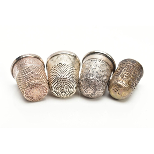 72 - FOUR THIMBLES, to include a 'Charles Horner' thimble hallmarked Chester 1906, 4.8 grams, one stamped... 