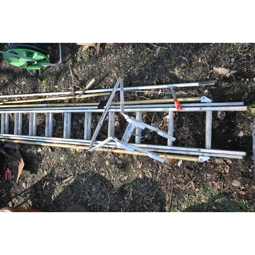 1107 - AN ALUMINIUM DOUBLE EXTENSION LADDER, and ladder stand-off, along with a selection of garden tools t... 