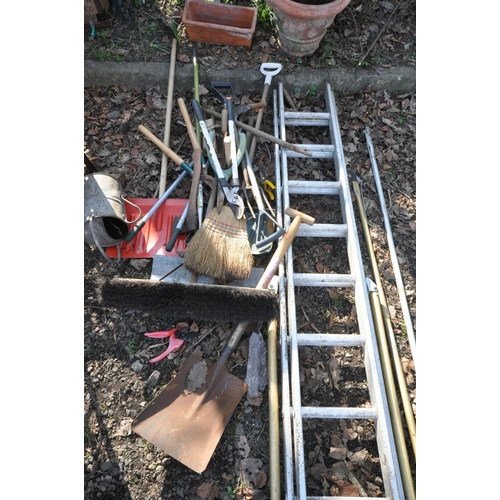 1107 - AN ALUMINIUM DOUBLE EXTENSION LADDER, and ladder stand-off, along with a selection of garden tools t... 