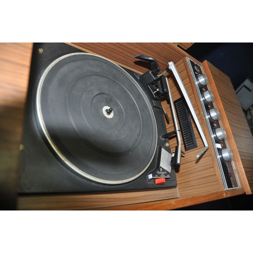 1333 - A VINTAGE HMV MODEL 2328 RADIOGRAM in a teak effect case with a Garrard 3000 turntable (PAT pass and... 