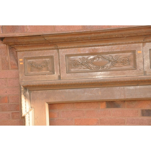 1335 - AN EDWARDIAN CAST IRON FIRE SURROUND with rope and swag with foliate detail lozenges to top frieze, ... 