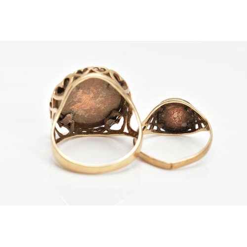 105 - TWO 9CT GOLD COIN RINGS, both with pierced detail to the shoulders, one set with an imitation sovere... 