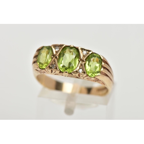 106 - A MODERN 9CT GOLD SEVEN STONE DRESS RING, designed with three oval cut peridots, interspaced with fo... 