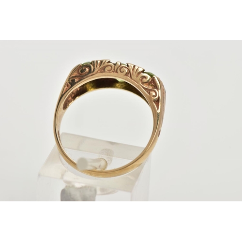 106 - A MODERN 9CT GOLD SEVEN STONE DRESS RING, designed with three oval cut peridots, interspaced with fo... 