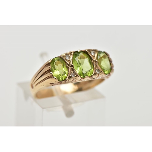 106 - A MODERN 9CT GOLD SEVEN STONE DRESS RING, designed with three oval cut peridots, interspaced with fo... 
